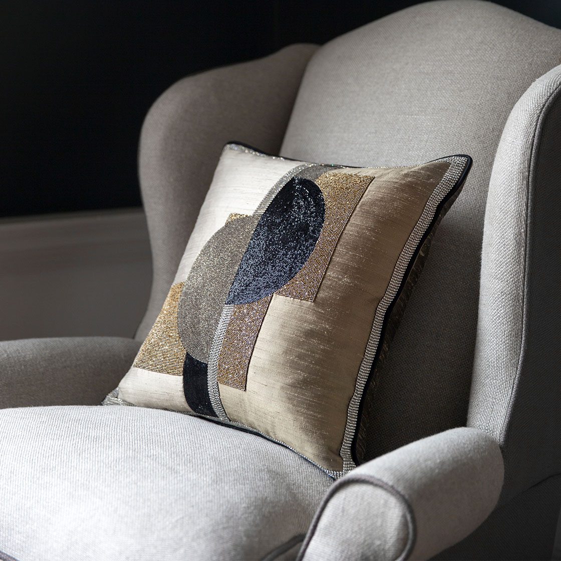 Club wing chair with Square legs in Donegal - Oatmeal and Slate with Piet cushion and Rococo light - Beaumont & Fletcher