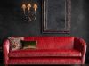 Josephine sofa in Como silk velvet - Pompeiian Red with Pisa wall light and Buckingham mirror with Habibi cushion - Beaumont & Fletcher