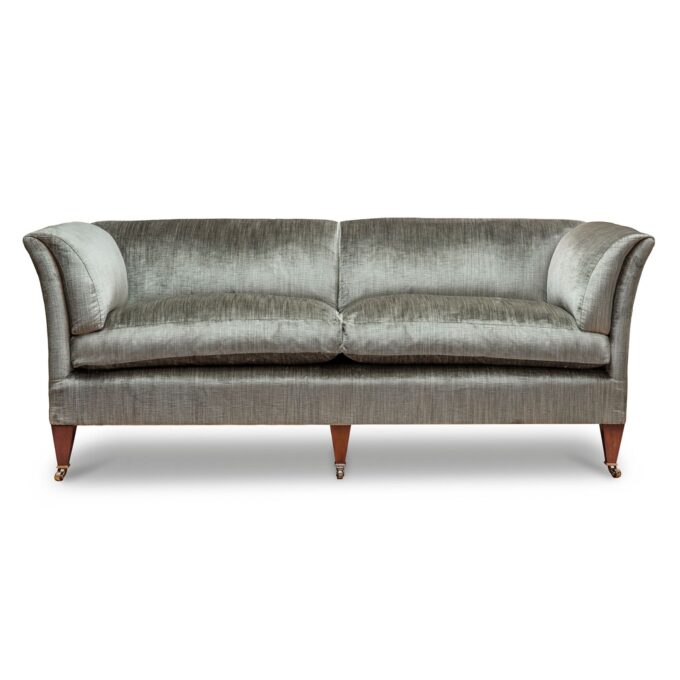 A bespoke, handmade sofa in a luxurious pale green silk velvet.