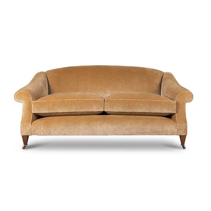 A luxurious deep seated sofa in a cream mohair fabric.
