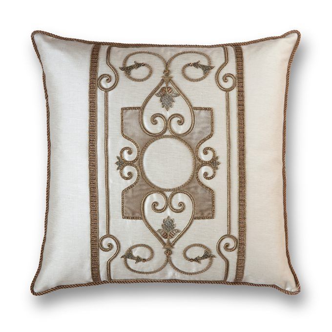 A hand embroidered designer cushion in cream