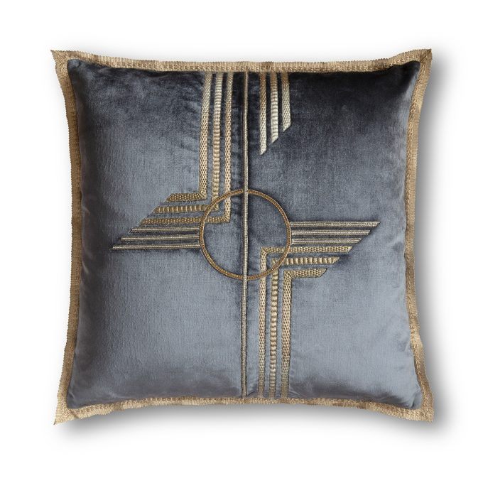 A blue silk velvet cushion with a modern hand embroidery design