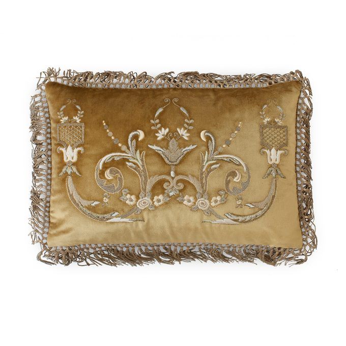 A hand embroidered designer cushion in silk velvet with an opulent pattern