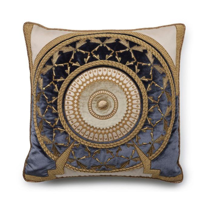A hand embroidered designer cushion with an opulent pattern