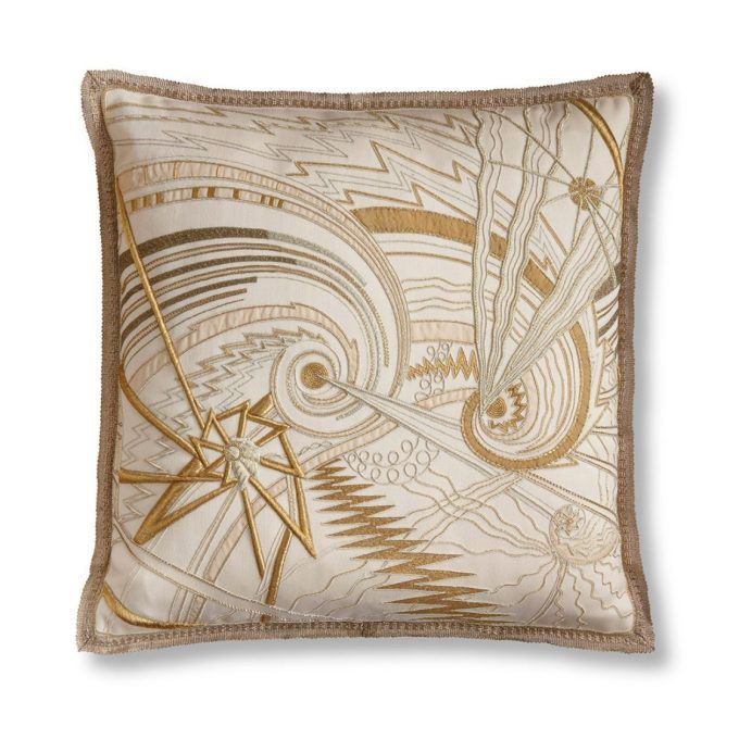 A hand embroidered designer cushion in silk velvet with a stellar pattern