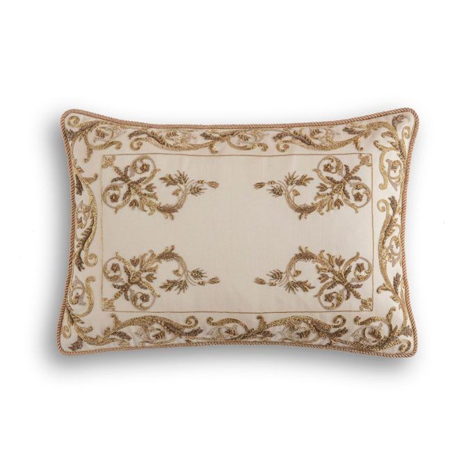 A hand embroidered designer cushion in cream wool