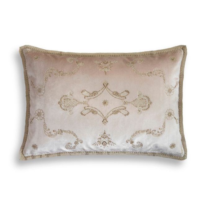 A hand embroidered rectangular designer cushion with a delicate pattern