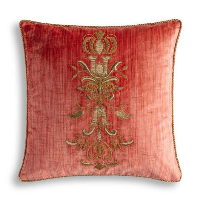 A hand embroidered designer cushion in red silk velvet