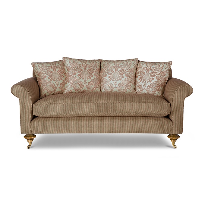 A luxury, bespoke sofa with contrasting back cushions.
