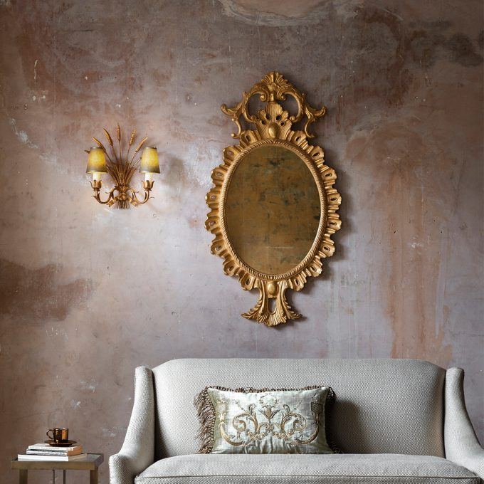 Belgrave mirror in Venice gold with Alexandra sofa and Thalia cushion and Wheatsheaf light