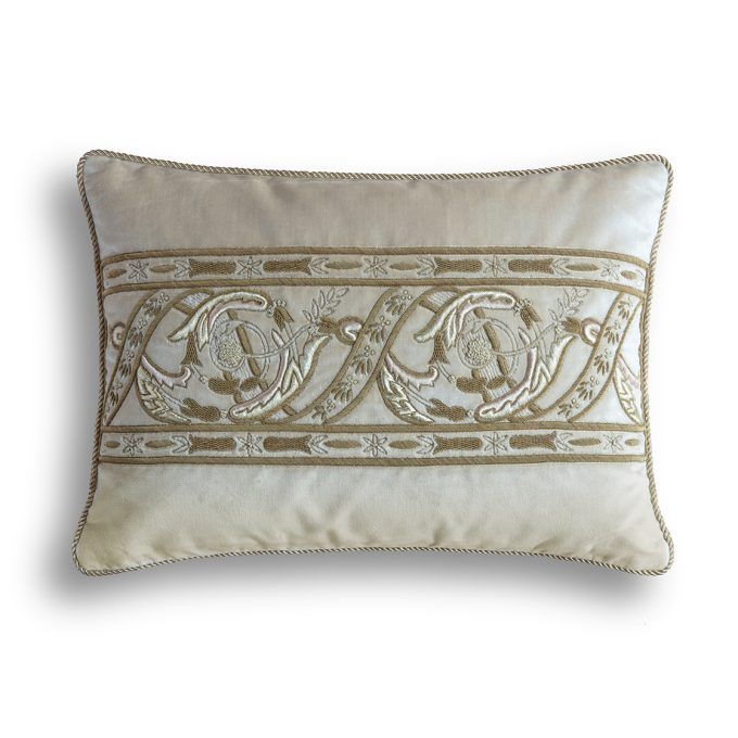 A hand embroidered designer cushion in silk velvet