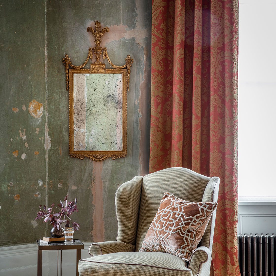 Windsor mirror in Burnt gold with Clubwing chair and Habibi cushion - Beaumont & Fletcher
