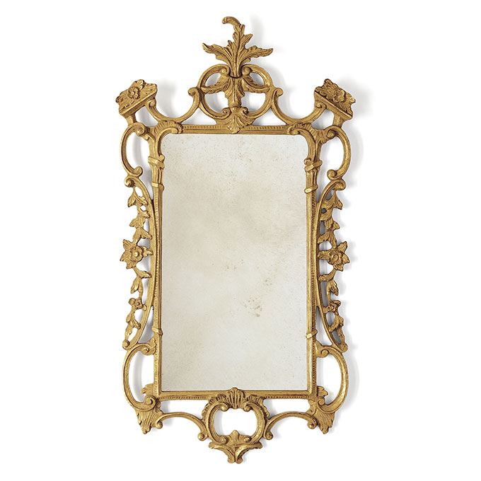 Ornate, Chippendale style mirror in burnt gold with antiqued glass.